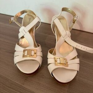 Marc Fisher white heels with gold buckle.